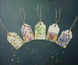 A set of 5 handmade gift tags featuring intricate watercolour designs on acid-free paper with biodegradable jute rope for attachment.