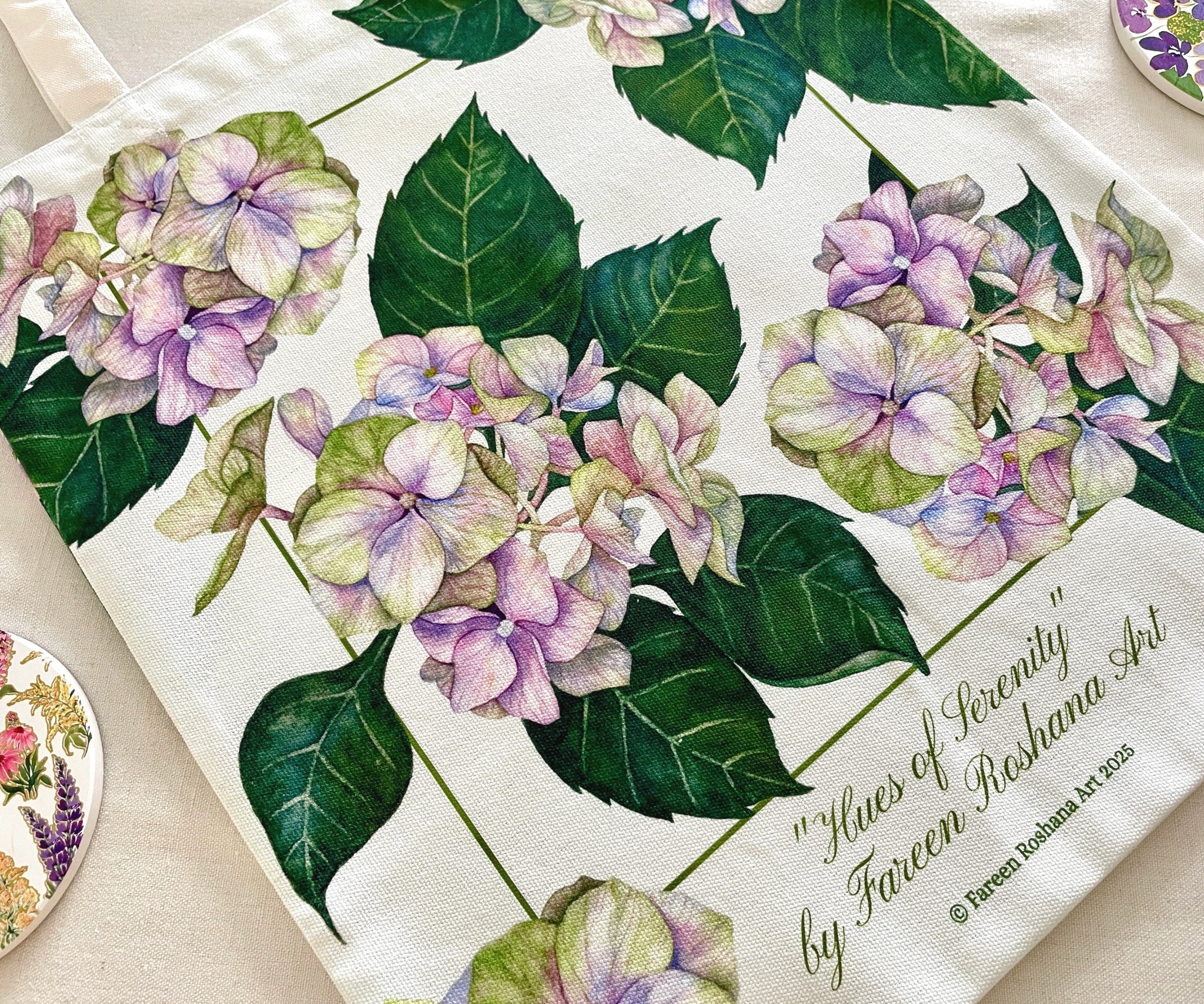 Close-up of Hues of Serenity tote bag featuring soft blue and purple watercolour hydrangeas printed on cotton canvas.