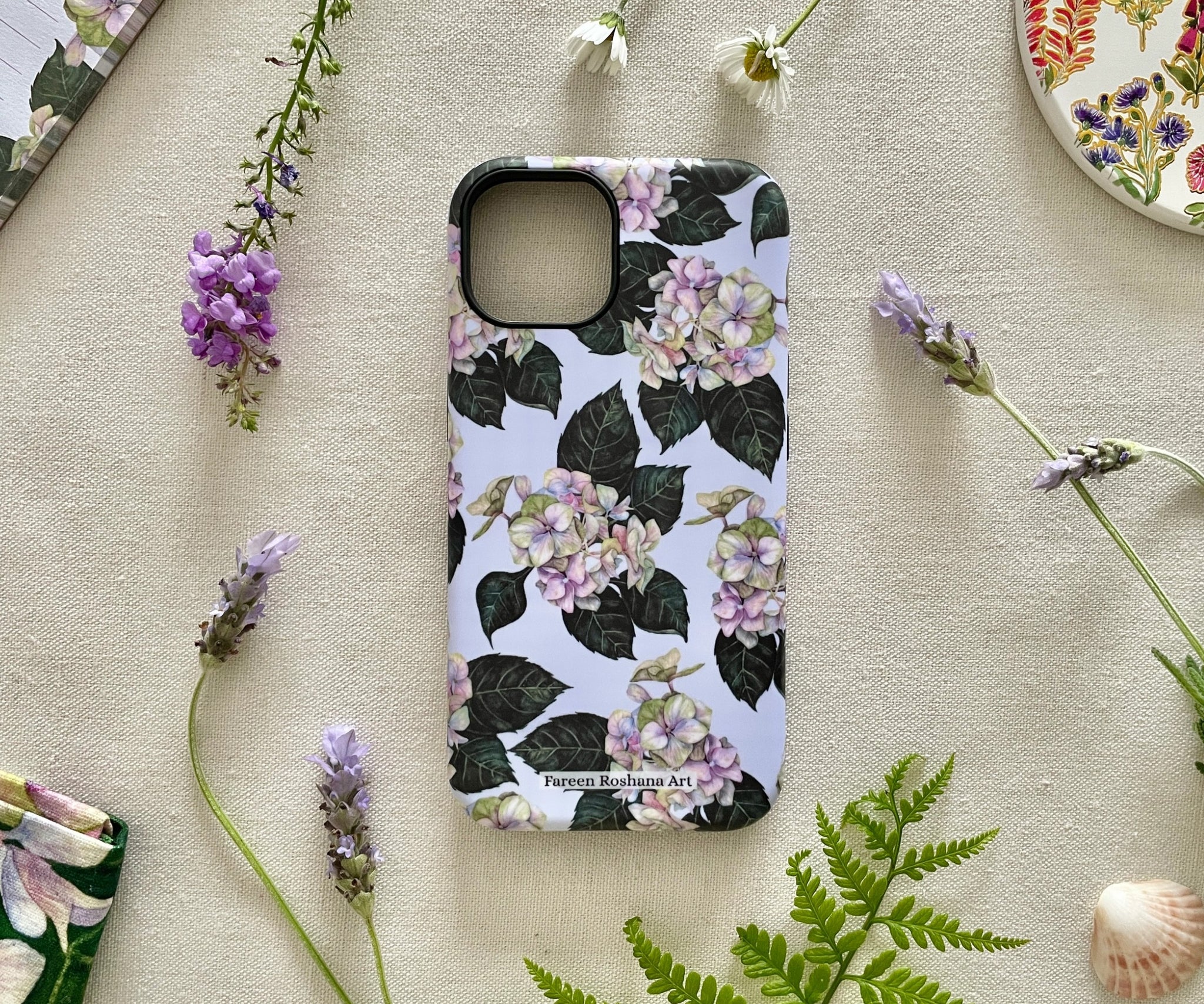 Front view of the Hues of Serenity iPhone case featuring original watercolour hydrangeas in blue and purple tones.