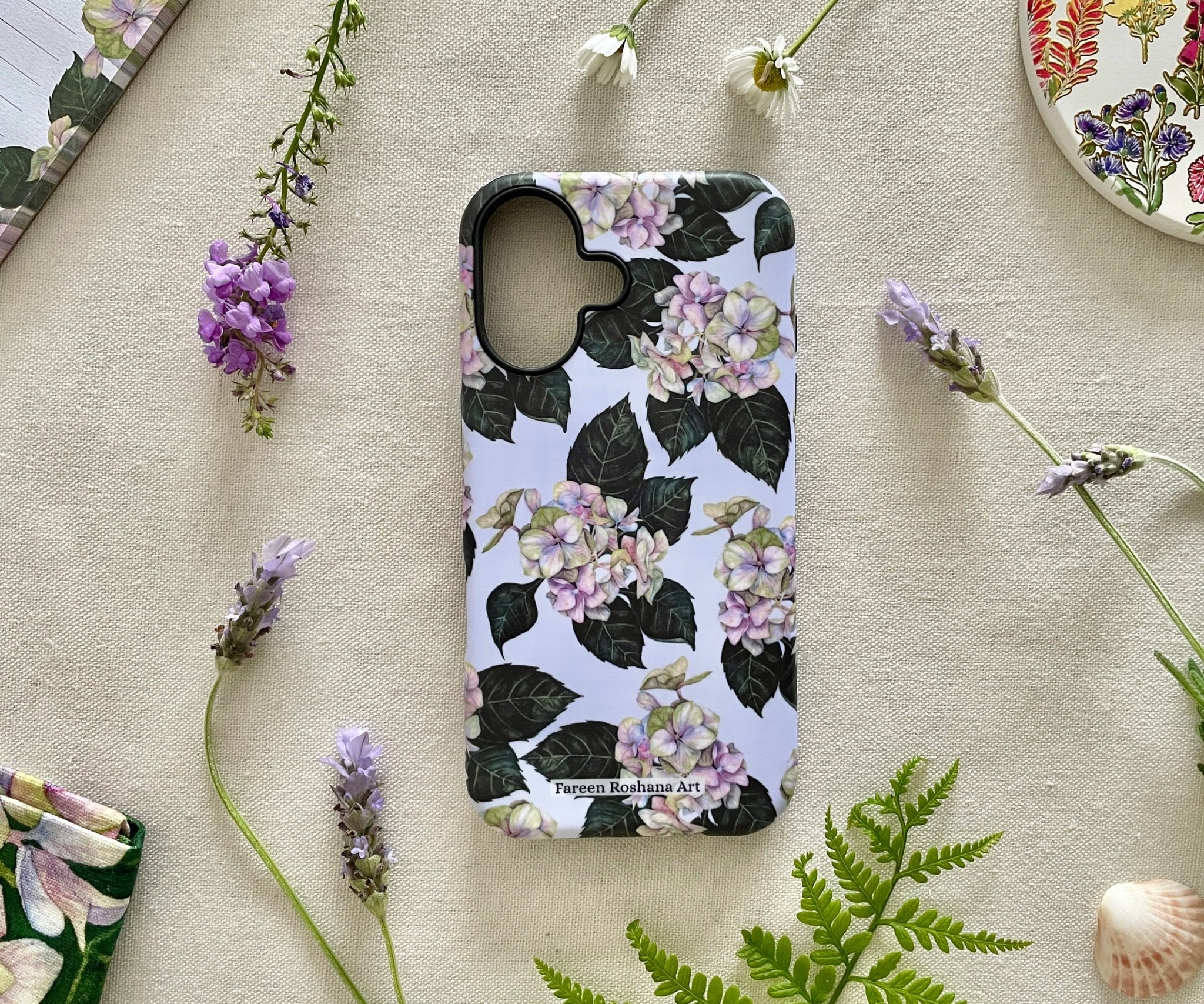 Front view of the Hues of Serenity iPhone case featuring original watercolour hydrangeas in blue and purple tones.