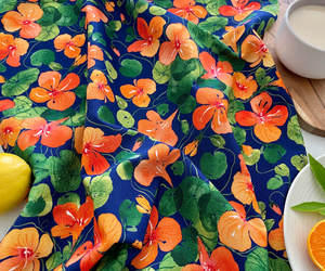 Close-up of Nasturtium Dreams tea towel with watercolour nasturtium print.