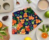 Folded Nasturtium Dreams tea towel showing cotton texture and floral details.