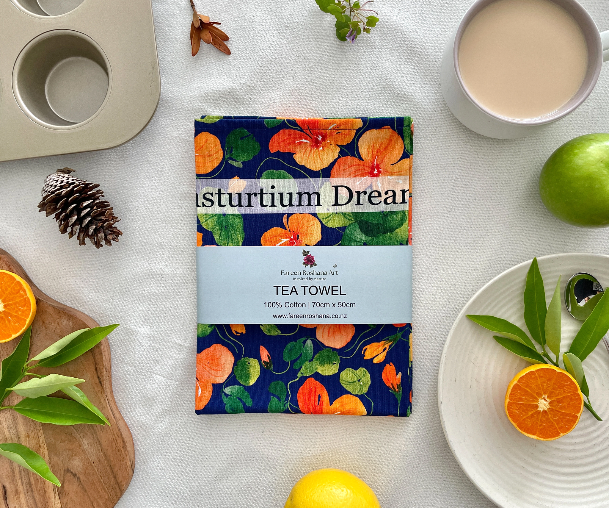 Nasturtium Dreams tea towel folded with belly band packaging, gift-ready.