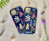 Two iPhones in floral cases side by side, showcasing the artistic wildflower design