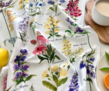 Close-up of Petals of the Wild tea towel with watercolour wildflower print.