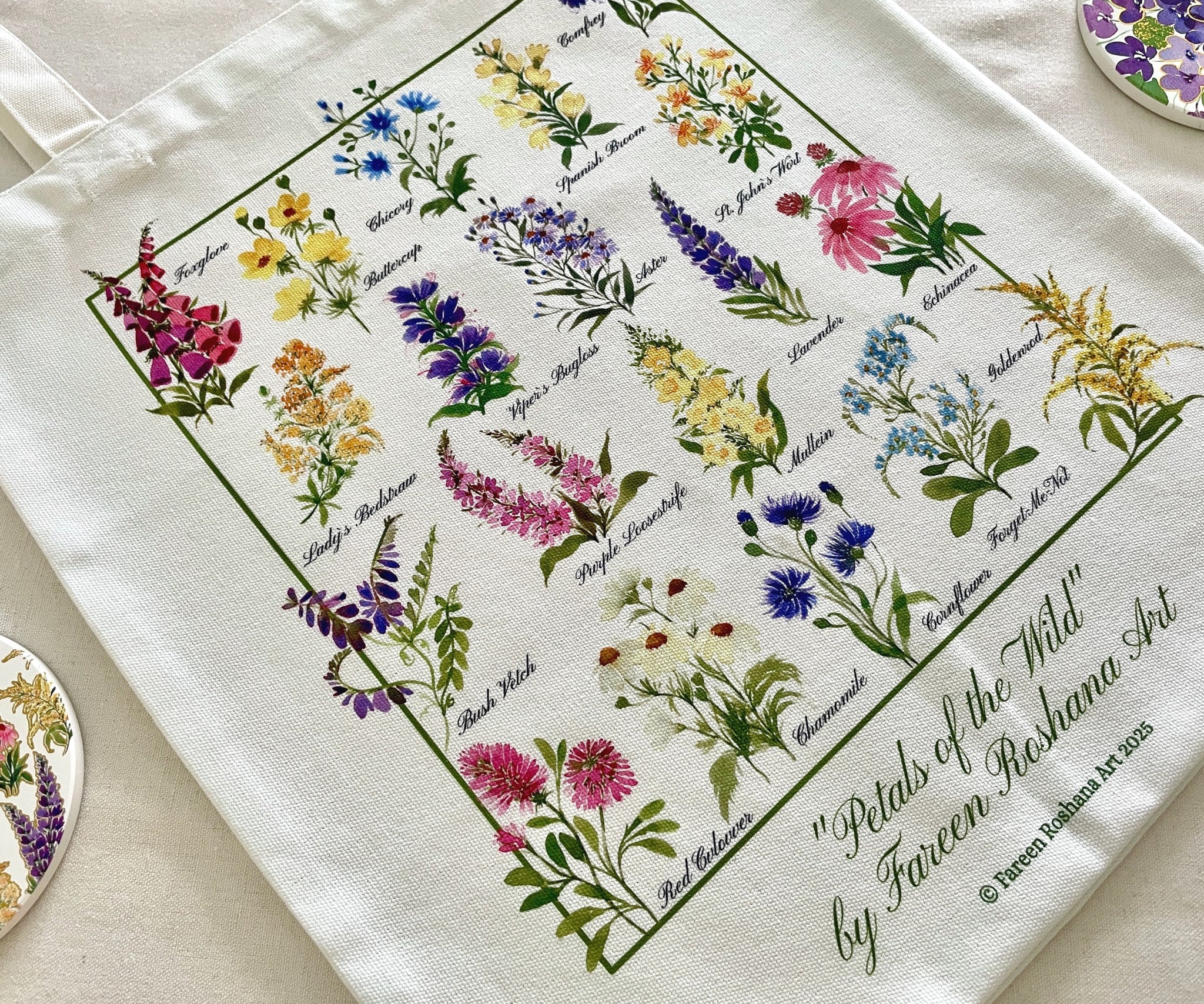 Close-up view of delicate wildflower watercolour print on white cotton tote bag