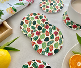 Seasonal Symphony ceramic tea coasters displaying four unique designs inspired by spring, summer, autumn, and winter