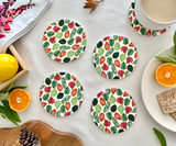 Seasonal Symphony ceramic tea coasters styled on a tea table, showcasing seasonal artwork and elegant ceramic finish
