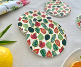 Seasonal Symphony set of four ceramic tea coasters featuring artistic designs inspired by the four seasons
