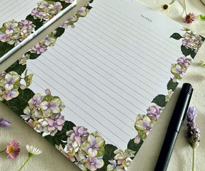 Close-up of Hues of Serenity A5 notepad showing hydrangea artwork