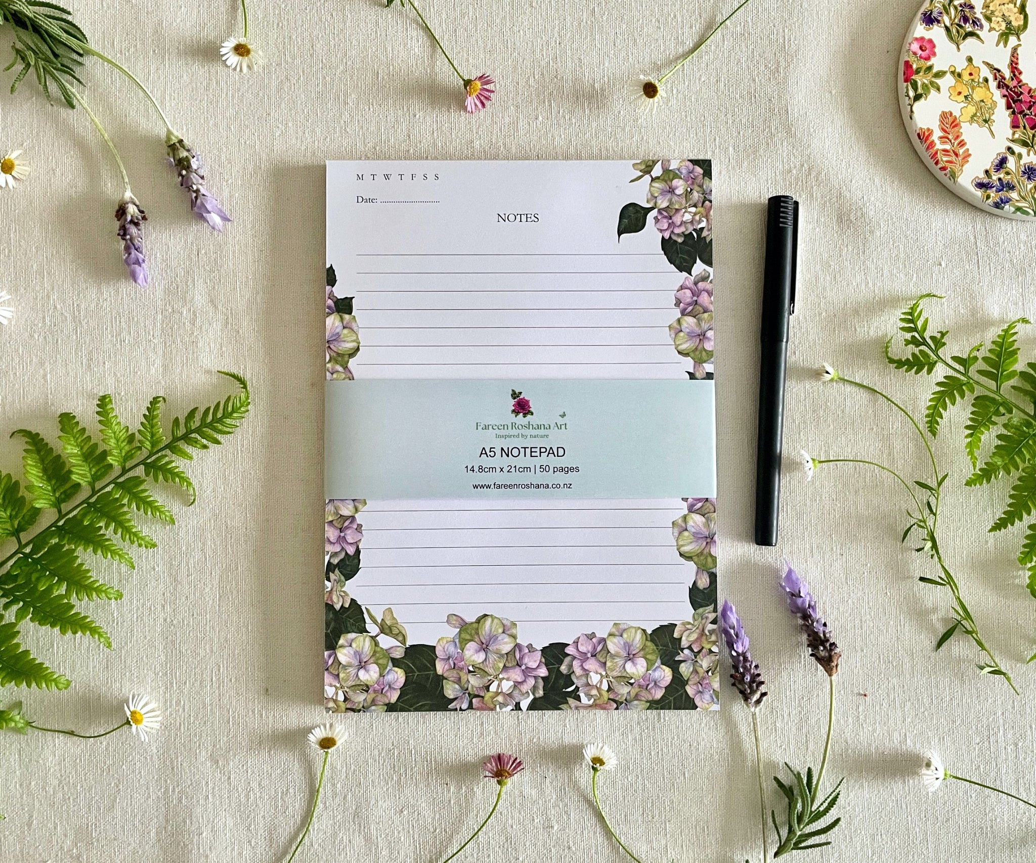 Front view of Hues of Serenity notepad with bellyband