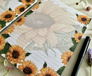 Close-up of sunflower artwork on Heart of Sunshine notepad