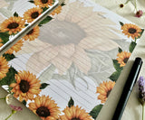 Close-up of sunflower artwork on Heart of Sunshine notepad