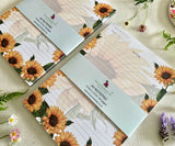 Two Heart of Sunshine notepads with bellybands close-up