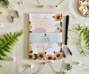 Front view of Heart of Sunshine sunflower notepad with bellyband
