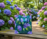 Hydrangea-floral-patterned bag on a wooden bench with hydrangea flowers in the background