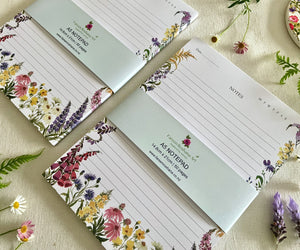 Two Petals of the Wild notepads with bellybands close-up