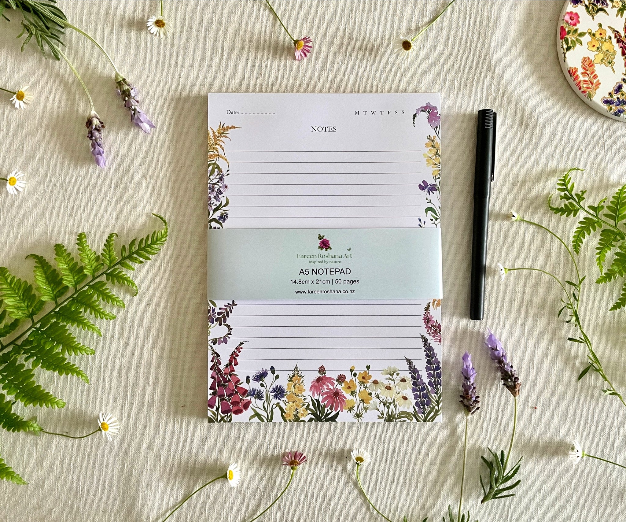 Front view of Petals of the Wild notepad with bellyband
