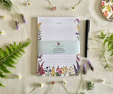 Front view of Petals of the Wild notepad with bellyband